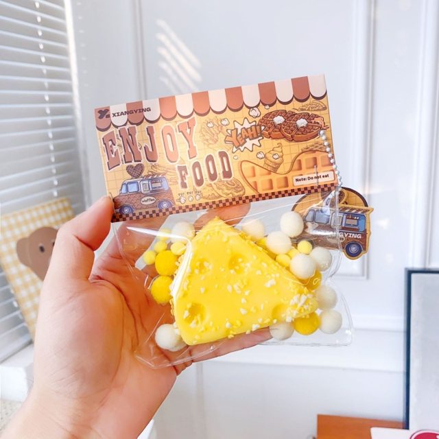 Pom-Pom Cheese Wedge Squishy Keychain